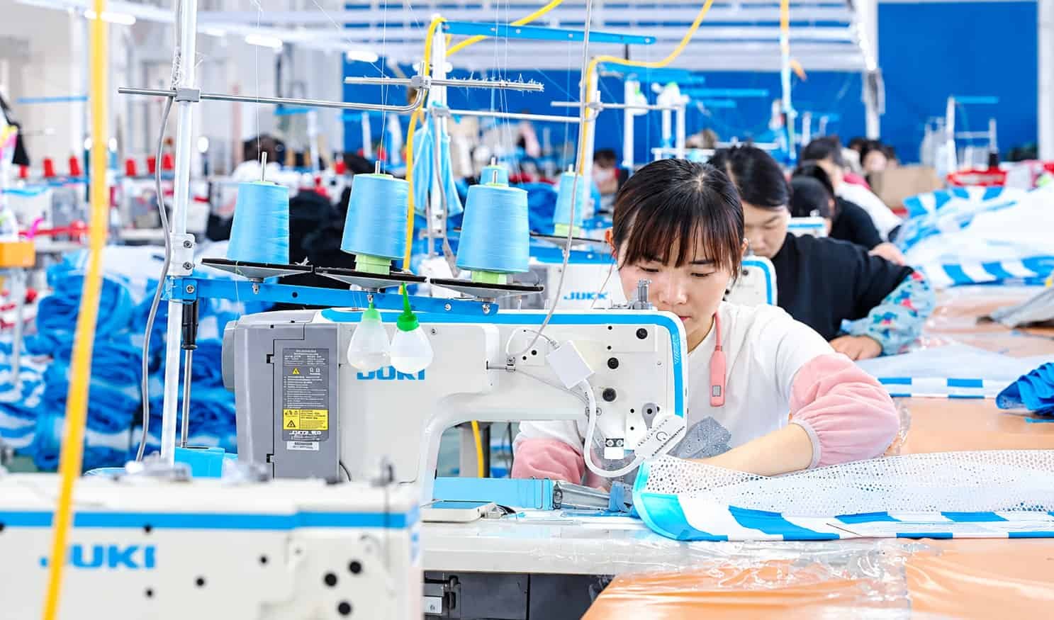 Sewing process for fabric-covered inflatable products at COMCO