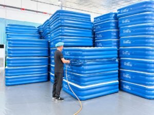 Inflated air mattress held for the 24-hour air retention inspection