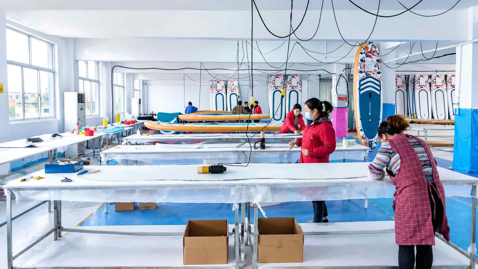 Inflatable SUP board production workshop with boards in progress
