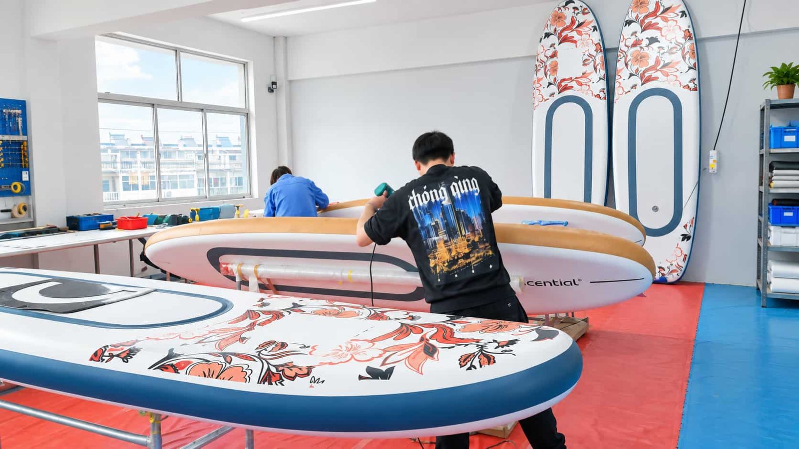 Inflated SUP board being finished and inspected before EVA and accessory assembly