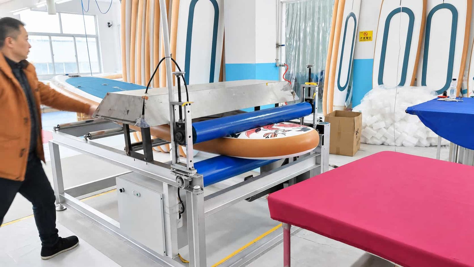 Accessories being pressed onto the EVA deck of an inflatable SUP board